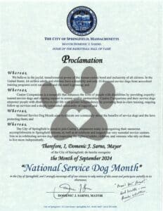 A proclamation from the city of Springfield, Massachusetts, by Mayor Domenic J. Sarno declaring September 2024 as "National Service Dog Month" to recognize the benefits of service dogs and their impact on people with disabilities.