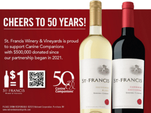 A promotional graphic celebrating 50 years of St. Francis Winery & Vineyards, featuring two wine bottles—one Sauvignon Blanc and one Cabernet Sauvignon—against a red background. The text highlights a partnership with Canine Companions, mentioning $500,000 donated since 2021 and includes a QR code and a dollar symbol.
